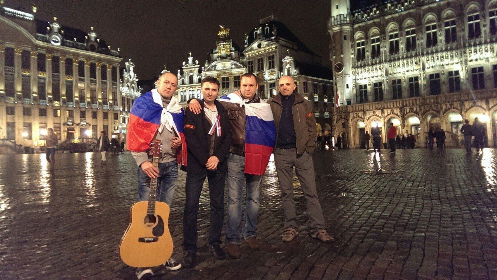 Roman Labin, in the center of Brussels, wearing a St. George’s ribbon — a symbol widely associated with Russian nationalism and militarism