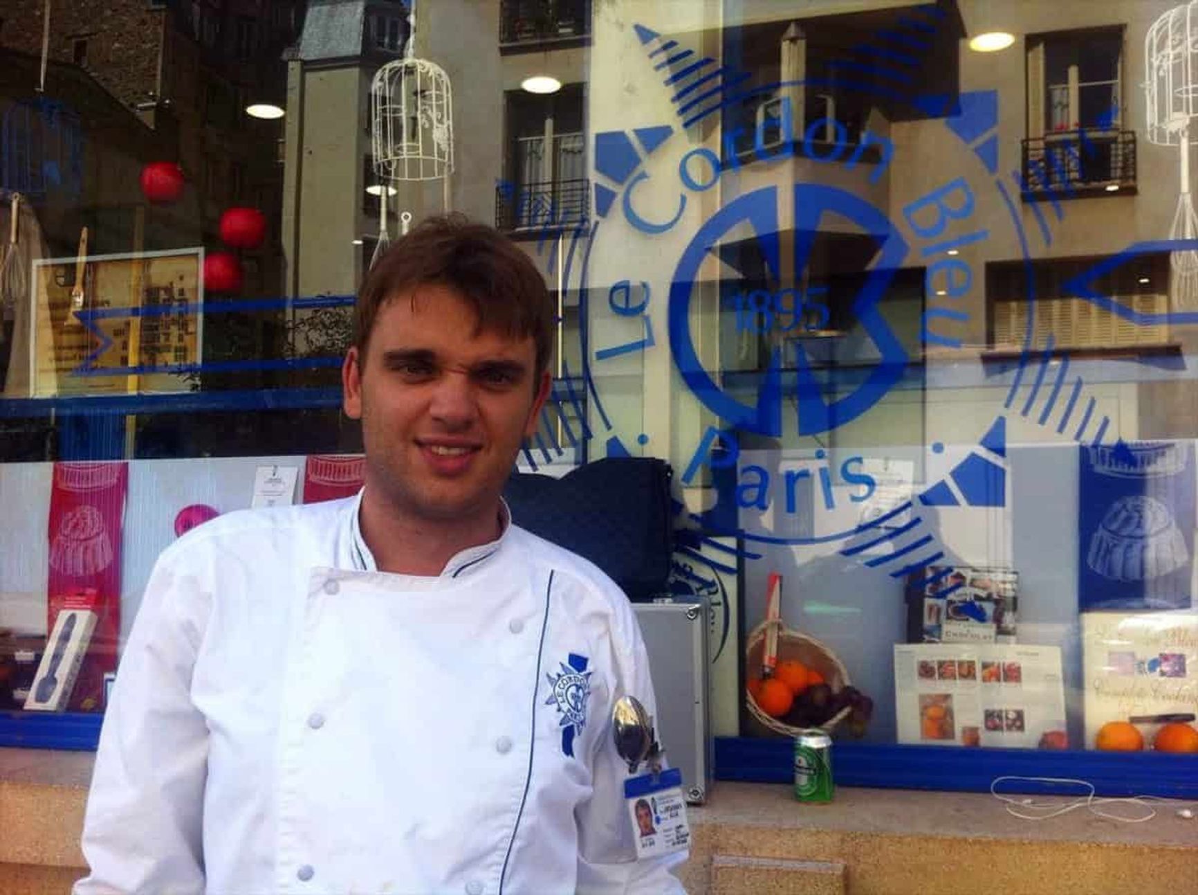 Griaznov posing in front of Le Cordon Bleu, the French culinary academy.